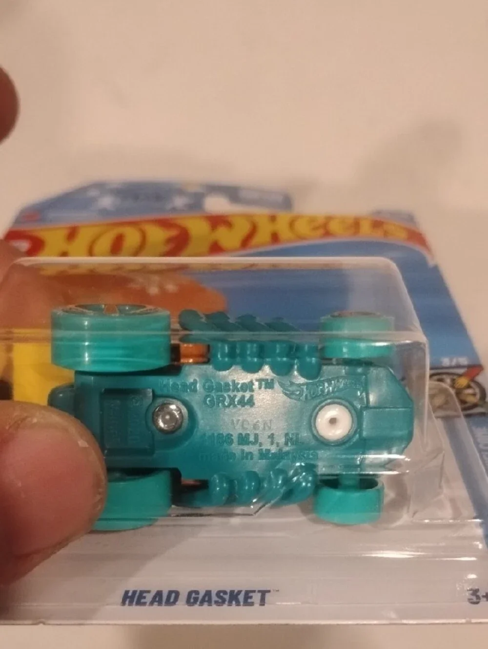 Mattel Hot Wheels Head Gasket in Orange and Teal
